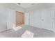 Bright bedroom with gray carpet and double door closet at 33339 Seattle Slew Dr, Sorrento, FL 32776