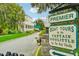 Entrance to a community featuring boat tours and lush landscaping at 33339 Seattle Slew Dr, Sorrento, FL 32776