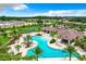 Community pool, clubhouse, and surrounding homes at 3384 Yellowtop Loop, Clermont, FL 34714