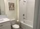 Clean bathroom with white vanity, tub, and shower at 3384 Yellowtop Loop, Clermont, FL 34714