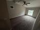 Spacious bedroom with neutral carpeting, ceiling fan, and window at 359 Prevo Dr, Apopka, FL 32712