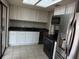 Bright kitchen featuring stainless appliances, black countertops, and ample cabinetry at 359 Prevo Dr, Apopka, FL 32712