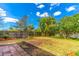 Spacious backyard with wooden fence and lush greenery at 4491 Yachtmans Ct, Orlando, FL 32812