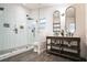 Modern bathroom with subway tile shower, double vanity, and dark wood cabinets at 4491 Yachtmans Ct, Orlando, FL 32812