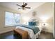 Bright bedroom with a ceiling fan and a comfortable bed at 4491 Yachtmans Ct, Orlando, FL 32812