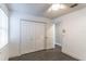 Bright bedroom with double door closet and dark gray tile floor at 4491 Yachtmans Ct, Orlando, FL 32812