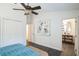 Spacious bedroom with updated bathroom and ceiling fan at 4491 Yachtmans Ct, Orlando, FL 32812