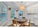 Charming kitchen dining area with a wooden table and four chairs at 4491 Yachtmans Ct, Orlando, FL 32812