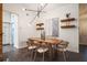 Dining area with a wooden table, wicker chairs, and stylish decor at 4491 Yachtmans Ct, Orlando, FL 32812