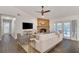 Living room featuring a fireplace, hardwood floors, and plenty of natural light at 4491 Yachtmans Ct, Orlando, FL 32812