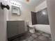 Updated bathroom with gray vanity and dark tile at 4706 Kanoy Dr, Lakeland, FL 33805