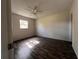 Bright bedroom with wood-look floors and ceiling fan at 4706 Kanoy Dr, Lakeland, FL 33805