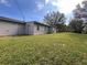 Side view of the house showing a large backyard at 4706 Kanoy Dr, Lakeland, FL 33805