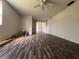 Living room with wood-look flooring and ceiling fan at 4706 Kanoy Dr, Lakeland, FL 33805