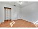 Bright bedroom with wood floors and built-in shelving at 4806 Hollyberry Dr, Orlando, FL 32812