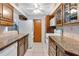 Kitchen with white appliances and wood cabinets at 4806 Hollyberry Dr, Orlando, FL 32812