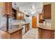 Galley style kitchen with wood cabinets and granite counters at 4806 Hollyberry Dr, Orlando, FL 32812