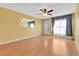 Spacious living room featuring laminate floors and ceiling fan at 4806 Hollyberry Dr, Orlando, FL 32812