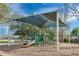 Community playground with shade structure at 4806 Hollyberry Dr, Orlando, FL 32812