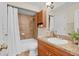 Clean bathroom with a tub and wood vanity at 4952 Tangerine Ave # 4952, Winter Park, FL 32792