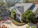 An aerial view of the house's side, highlighting the landscaping and driveway at 506 N Dillard St, Winter Garden, FL 34787