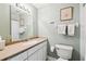 Clean bathroom with a single vanity, toilet, and shower at 506 N Dillard St, Winter Garden, FL 34787