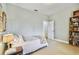 Light and airy bedroom with window, built-in shelving and ample closet space at 506 N Dillard St, Winter Garden, FL 34787