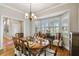 Formal dining room with hardwood floors and a charming wooden table at 506 N Dillard St, Winter Garden, FL 34787