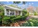 Charming house with a red door, manicured hedges, and a well-maintained lawn at 506 N Dillard St, Winter Garden, FL 34787