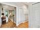 Light hardwood floors and neutral walls in a bright hallway at 506 N Dillard St, Winter Garden, FL 34787