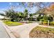 Cute house exterior with a white picket fence and palm trees at 506 N Dillard St, Winter Garden, FL 34787