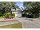 House exterior with a golf cart and attached garage at 506 N Dillard St, Winter Garden, FL 34787