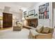 Cozy living room features a fireplace and built-in bookshelves at 506 N Dillard St, Winter Garden, FL 34787