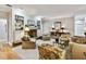 Bright living room with hardwood floors, fireplace, built-in shelving and comfortable seating at 506 N Dillard St, Winter Garden, FL 34787