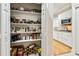 Well-organized pantry with ample shelving for storage at 506 N Dillard St, Winter Garden, FL 34787