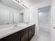 Double vanity bathroom with modern finishes at 5627 Costa Blanca Way, Davenport, FL 33897