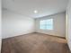 Bright bedroom with neutral walls and carpet at 5627 Costa Blanca Way, Davenport, FL 33897