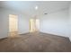 Spacious bedroom with plush carpeting and ample closet space at 5627 Costa Blanca Way, Davenport, FL 33897