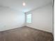 Bright bedroom with neutral walls and carpet at 5627 Costa Blanca Way, Davenport, FL 33897