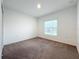 Bright bedroom with neutral walls and carpet at 5627 Costa Blanca Way, Davenport, FL 33897