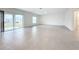 Bright living area with tile flooring and sliding glass doors at 5627 Costa Blanca Way, Davenport, FL 33897