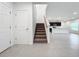 Modern staircase with carpet runner, leading to upper level at 5627 Costa Blanca Way, Davenport, FL 33897