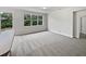 Large bedroom with neutral walls and carpet, plus backyard access at 644 Maya Susan Loop, Apopka, FL 32712