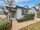 House exterior with walkway, landscaping, and blue door at 644 Maya Susan Loop, Apopka, FL 32712