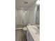 Updated bathroom with walk-in shower and modern vanity at 6581 Quest St, St Cloud, FL 34771