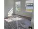 Well-lit bedroom with carpet and window view at 6581 Quest St, St Cloud, FL 34771