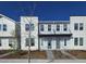 Modern townhome with white and gray exterior at 6581 Quest St, St Cloud, FL 34771