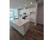 Modern kitchen with white cabinets and quartz countertops at 6581 Quest St, St Cloud, FL 34771