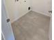 Bright laundry room with gray tile floor at 6581 Quest St, St Cloud, FL 34771