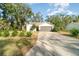 Newly renovated single-story home with a two-car garage and nicely landscaped yard at 701 Grant Ave, Mount Dora, FL 32757